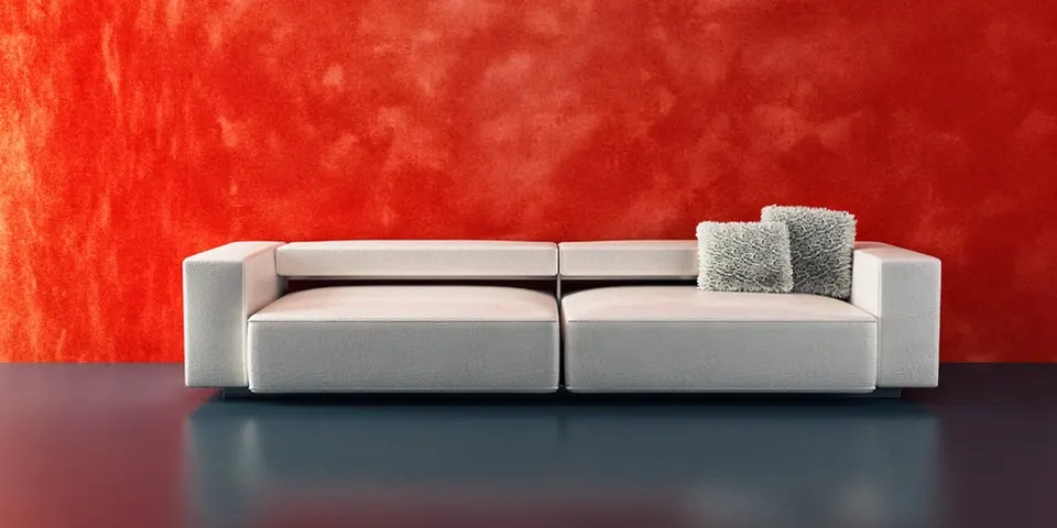 Rot gestaltete Wand mit dekorativer Oberflächentechnik